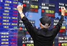 Asian markets head for negative end to tough week