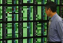 Asian equities climb as countries slowly reopen