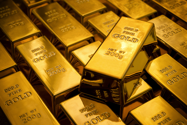 Gold edges higher as stocks slide; metal heads for third weekly gain