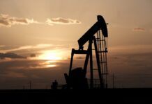 Oil extends losses to near two-month low as economic gloom weighs
