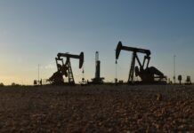 Oil hovers near three-month highs on trade progress, lower inventories