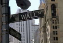 Dow ends 1.9% lower after terrible US economic data