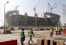 Qatar raises minimum wage, lifts curbs on changing jobs