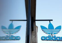 Adidas cautious for year end as pandemic returns