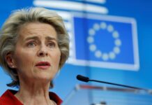 Stocks hit record high as Biden transition, vaccines brighten outlook