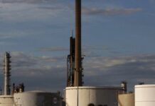 Oil rises to touch $52 after Trump signs aid bill