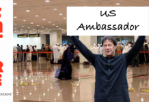 PM Khan spotted at Islamabad Airport arrivals holding sign saying “US Ambassador“